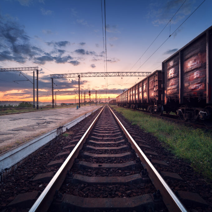 Cargo train platform at sunset. Railroad in Ukraine. Railway sta Cargo train platform at sunset. Railroad in Ukraine. Railway sta