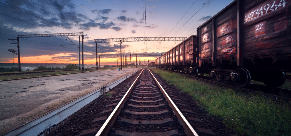 Cargo train platform at sunset. Railroad in Ukraine. Railway sta Cargo train platform at sunset. Railroad in Ukraine. Railway sta